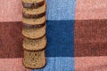 A line of slices of brown bread on a tablecloth Royalty Free Stock Photo