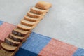 A line of slices of brown bread on a tablecloth Royalty Free Stock Photo