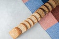 A line of slices of brown bread on a tablecloth Royalty Free Stock Photo