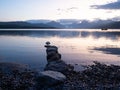 Line of Stones from Shore into Lake McDonald in Glacier National Park at Dawn Royalty Free Stock Photo