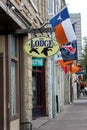 Line of storefronts and signs announcing each business, downtown Austin, Texas, 2018