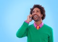 On the line with style. Studio shot of a handsome young man talking on a cellphone. Royalty Free Stock Photo