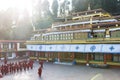 Line of Tibetan monks in front of Rumtek Monastery for welcoming high level monk near Gangtok. Sikkim, India. Royalty Free Stock Photo