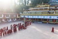 Line of Tibetan monks in front of Rumtek Monastery for welcoming high level monk near Gangtok. Sikkim, India. Royalty Free Stock Photo