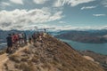 Line of tourist waiting for a photo on Roys Peak on south island in New Zealand