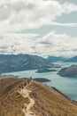 Line of tourist waiting for a photon on Roys Peak at south island in New Zealand