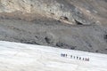 Line of tourists walking on Athabasca glacier in Columbia Icefield, Jasper National park, Rocky Mountains, Alberta Canada Royalty Free Stock Photo