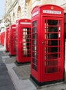 Line of typical old fashioned british red public telephone boxes outside the former post office in Blackpool Lancashire