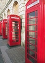 Line of typical old fashioned british red public telephone boxes outside the former post office in Blackpool Lancashire Royalty Free Stock Photo