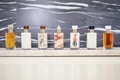 a line of unbranded jarred lotions on a granite slab Royalty Free Stock Photo