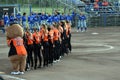 Line up and playing the National anthems prior to the softballgame Royalty Free Stock Photo