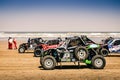 Line up of side by side SxS buggies on the beach of Plage Blanche on the start of the Morocco Desert Challenge 2023.