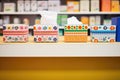 line of variously designed tissue boxes on a supermarket shelf Royalty Free Stock Photo