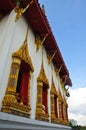 A line of windows Ancient Golden carving wooden door of Thailand