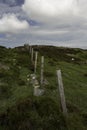 Line of farm fence posts Royalty Free Stock Photo