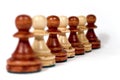 Line of wooden pawns Royalty Free Stock Photo