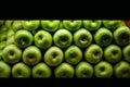 Lined green apples on a counter Royalty Free Stock Photo