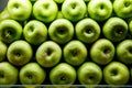 Lined green apples on a counter Royalty Free Stock Photo
