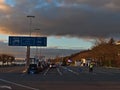 Lined up cars waiting for the car ferry to Konstanz in order to cross Lake Constance in evening light in winter season. Royalty Free Stock Photo