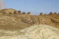 Lined up dramatically atop a rocky ridge, the Beehive Tombs