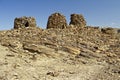 Lined up dramatically atop a rocky ridge, the Beehive Tombs