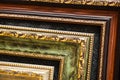 Lined up old wooden vintage art frames. Close-up fragment