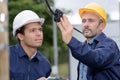 Lineman checking outdoor cable Royalty Free Stock Photo