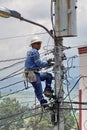 Lineman on a power pole Royalty Free Stock Photo