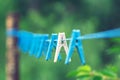 Linen clothespins on a rope Royalty Free Stock Photo