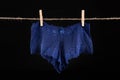 Linen drying on a string. Sexy women& x27;s panties pinned to a string Royalty Free Stock Photo