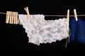 Linen drying on a string. Sexy women& x27;s panties pinned to a string