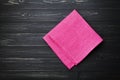 Linen kitchen towel or napkin on black wooden background Royalty Free Stock Photo