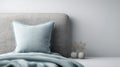 linen pillow on clean headboard with bare wall texture and open space Royalty Free Stock Photo
