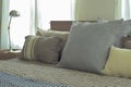 Linen pillows in difference size on bed in modern japanese style bedroom