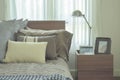 Linen pillows in difference size on bed in modern japanese style bedroom interior
