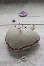 Linen pin-cushion with colored pins