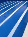 Lines of the bottom of a half filled blue pool with a composition with the lines of the roads vanishing, v Royalty Free Stock Photo