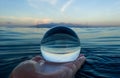 Blue Ripples on Ocean Surface Captured in Glass Ball Royalty Free Stock Photo