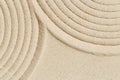 Lines drawing on sand, beautiful sandy texture. Spa background, concept for meditation and relaxation Royalty Free Stock Photo