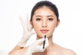 Lines on face, close up, plastic surgery concept, doctor`s hand in glove making marks on patient`s face..Asian beauty  Woman in Royalty Free Stock Photo