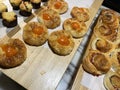 Lines of fresh baked sweet puff pastry stuffed with apricot and peach jelly Royalty Free Stock Photo