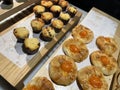 Lines of fresh baked sweet puff pastry stuffed with apricot and peach jelly Royalty Free Stock Photo