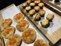 Lines of fresh baked sweet puff pastry stuffed with apricot and peach jelly Royalty Free Stock Photo