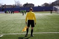 Linesman with flag on the football field