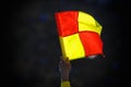 Football foul flag on the background of the stands during soccer match