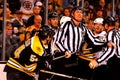 Linesman Shane Heyer separates two players.