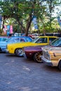 A lineup of classic American cars on Hotrodiningrat parking lot
