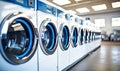 A Lineup of Modern Washing Machines in a Spacious, Well-lit Laundry Room Royalty Free Stock Photo