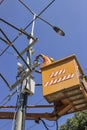 Lineworker works on power overhead Royalty Free Stock Photo