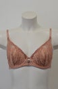 Lingerie. Beige lace bra on a mannequin in a lingerie store. Fashion collection